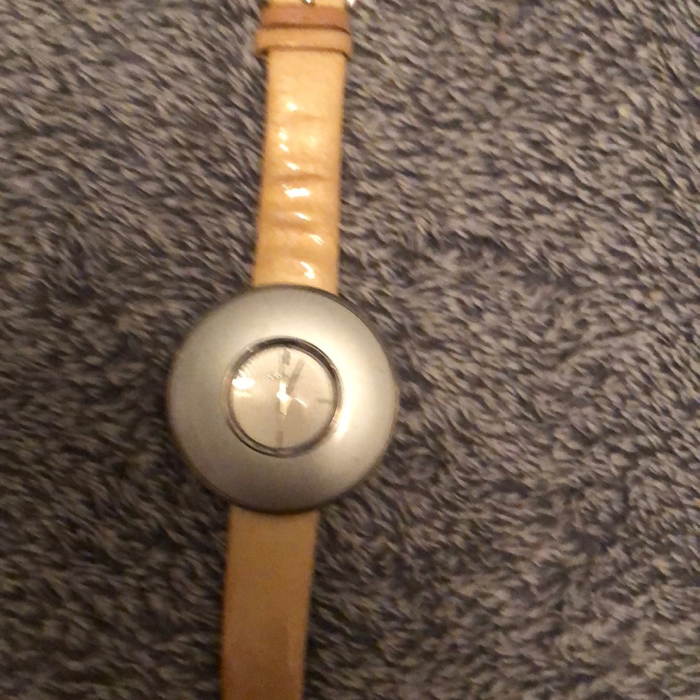 DKNY ladies silver dial, please note scratches bezel vintage, leather strap.